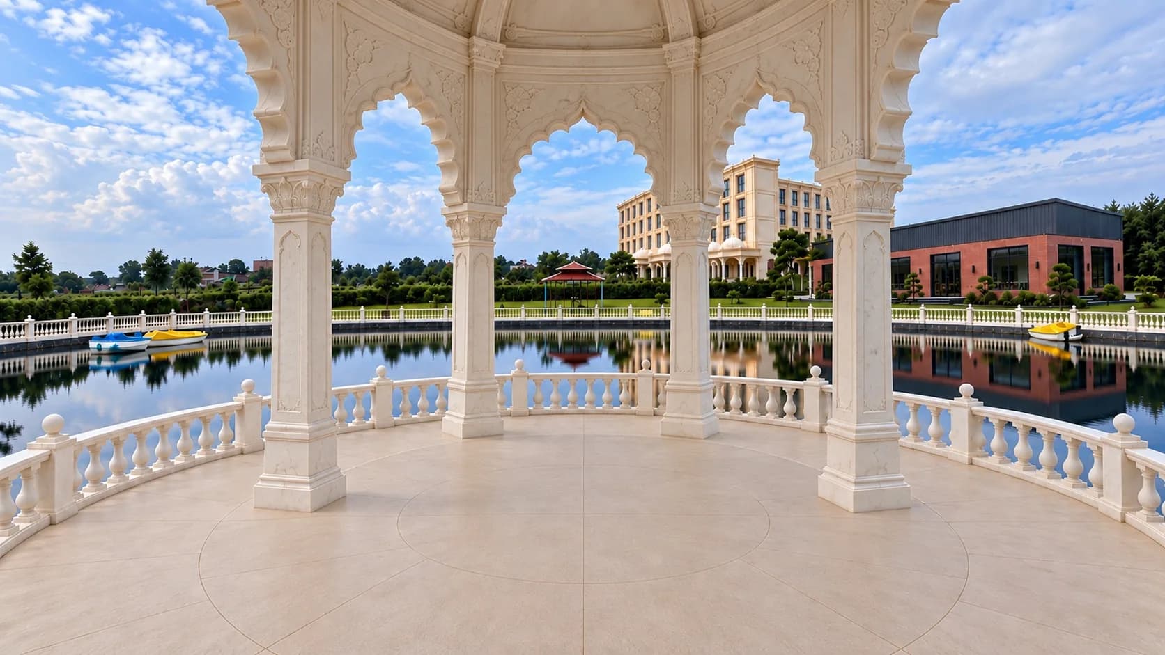 Inside the white marble mandap by day: carved pillars on a circle, the open floor under the dome and the pond all round